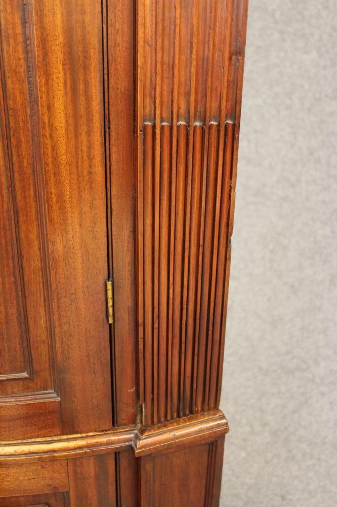 A GEORGIAN MAHOGANY BOWED STANDING CORNER CUPBOARD Image