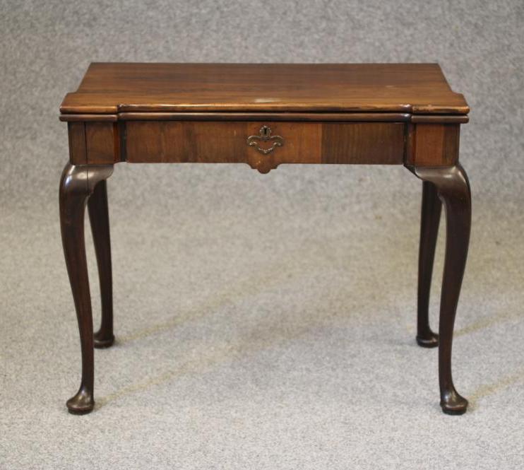 A GEORGE II MAHOGANY FOLDING CARD TABLE Image