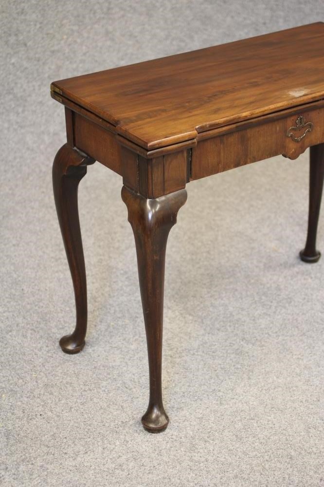 A GEORGE II MAHOGANY FOLDING CARD TABLE Image