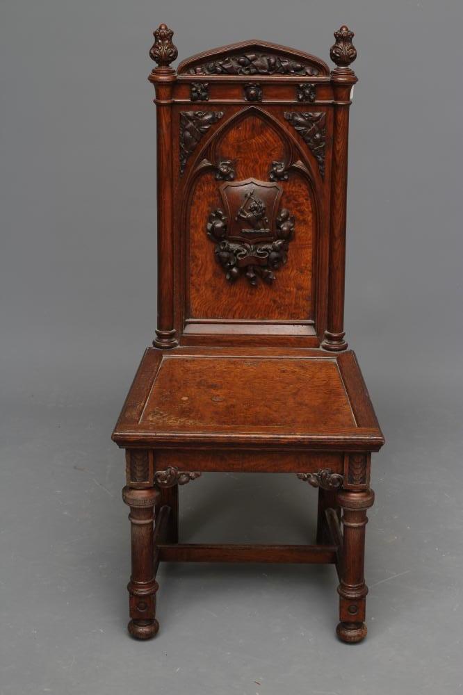 A VICTORIAN GOTHIC POLLARD OAK CARVED HALL CHAIR Image