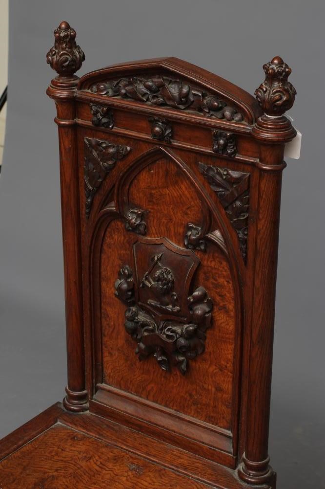 A VICTORIAN GOTHIC POLLARD OAK CARVED HALL CHAIR Image