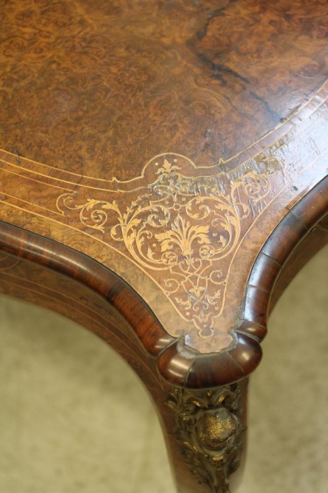 A VICTORIAN LOUIS XV STYLE BIRDS EYE MAPLE BUREAU PLAT with marquetry foliate sprays Image