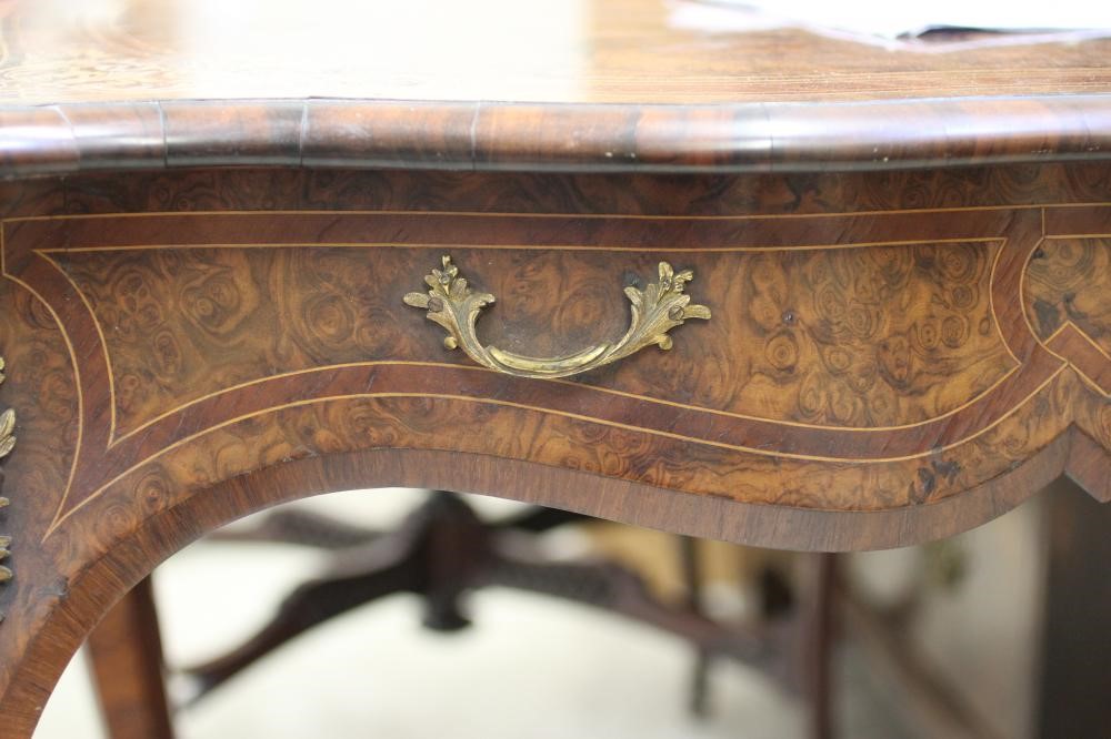 A VICTORIAN LOUIS XV STYLE BIRDS EYE MAPLE BUREAU PLAT with marquetry foliate sprays Image