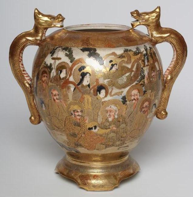 A SATSUMA EARTHENWARE VASE of rounded flared form with two dragon handles on a fixed "stand" and Image