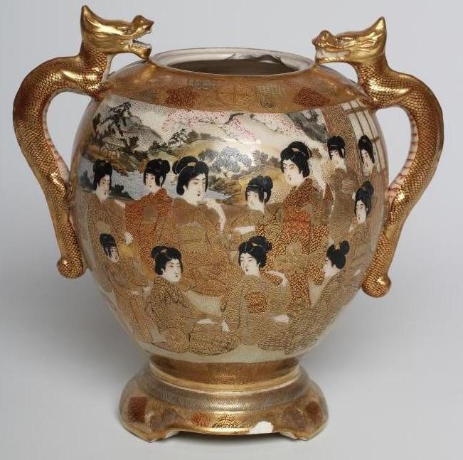 A SATSUMA EARTHENWARE VASE of rounded flared form with two dragon handles on a fixed "stand" and Image