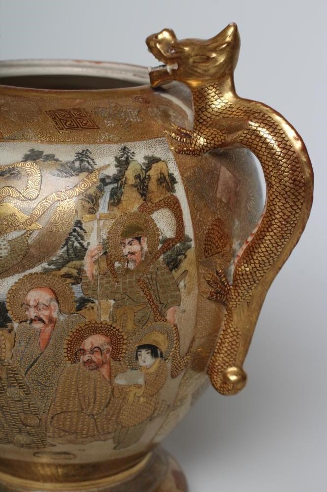 A SATSUMA EARTHENWARE VASE of rounded flared form with two dragon handles on a fixed "stand" and Image