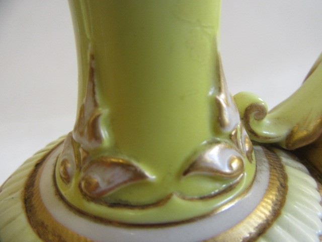 A PAIR OF ROYAL WORCESTER HADLEY WARE EWERS Image