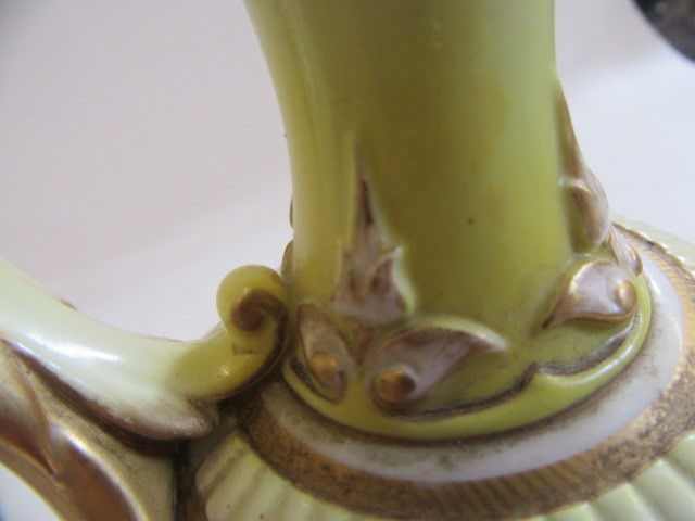 A PAIR OF ROYAL WORCESTER HADLEY WARE EWERS Image