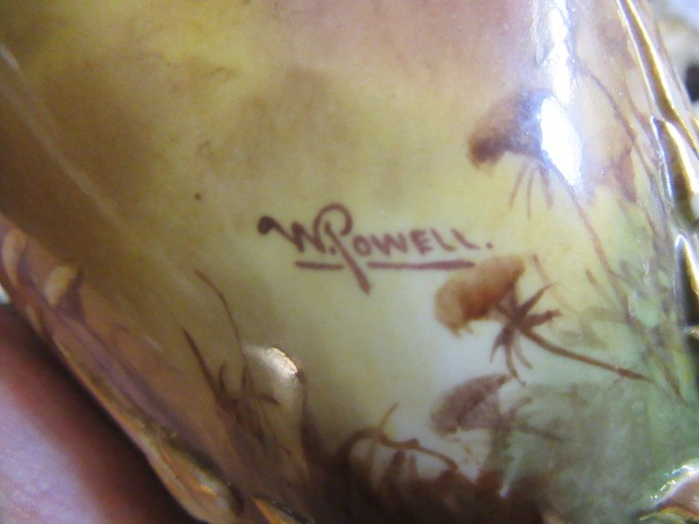 A PAIR OF ROYAL WORCESTER HADLEY WARE EWERS Image