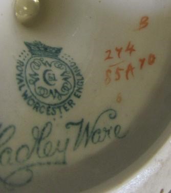 A PAIR OF ROYAL WORCESTER HADLEY WARE EWERS Image