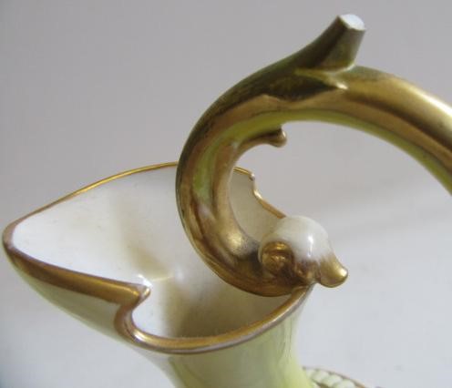 A PAIR OF ROYAL WORCESTER HADLEY WARE EWERS Image