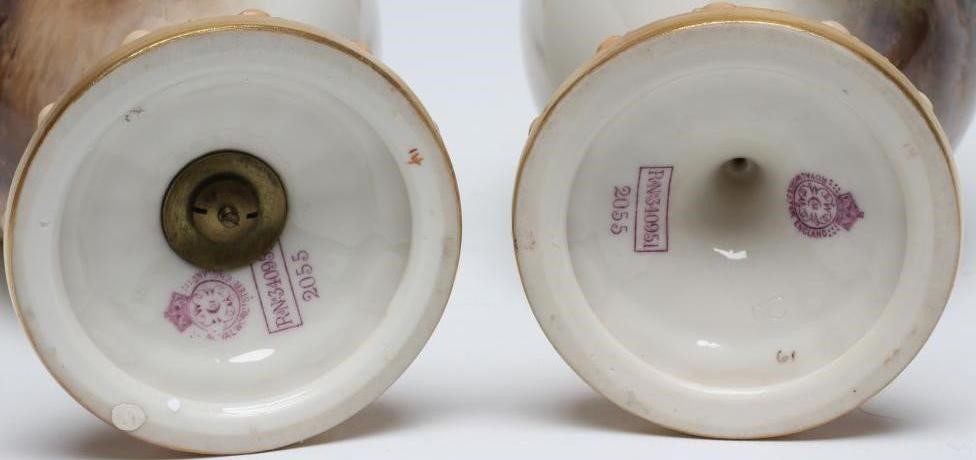 A PAIR OF ROYAL WORCESTER EWERS Image