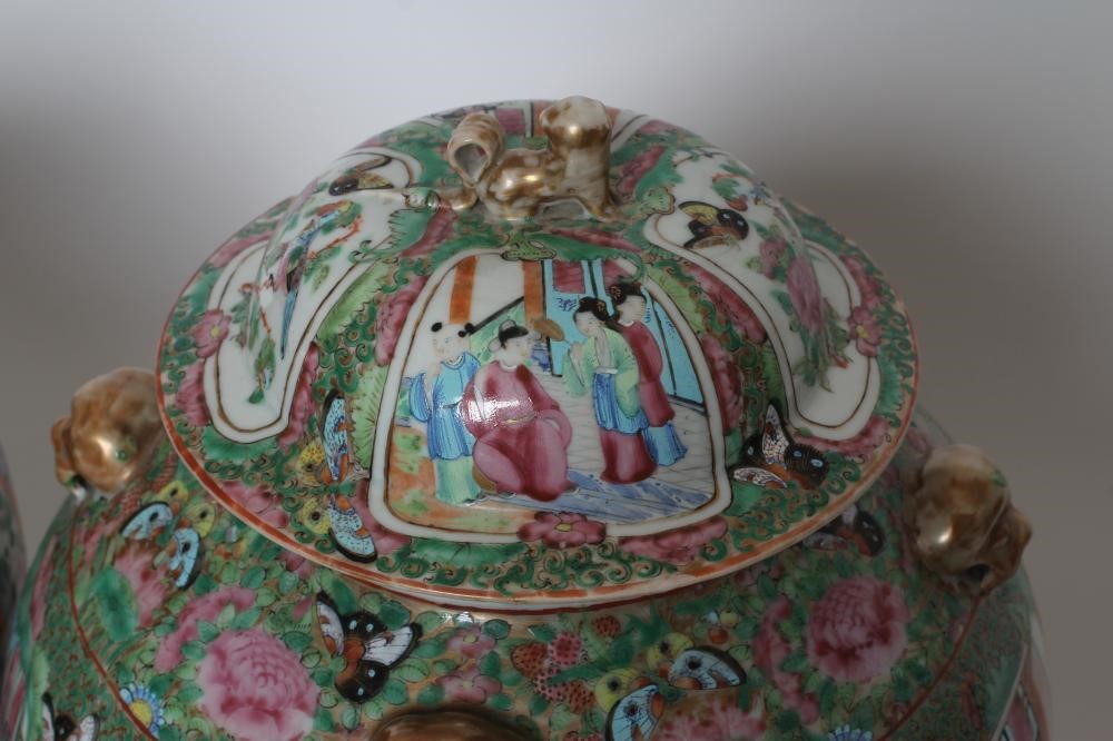 A PAIR OF CHINESE PORCELAIN JARS AND COVERS of inverted baluster form each with four pierced mask Image