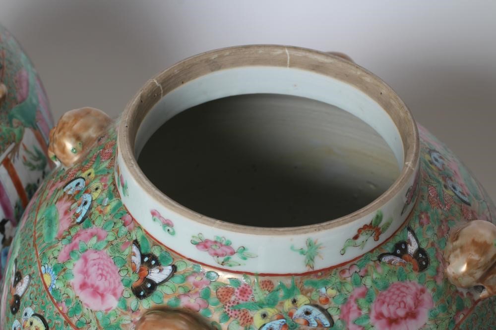 A PAIR OF CHINESE PORCELAIN JARS AND COVERS of inverted baluster form each with four pierced mask Image