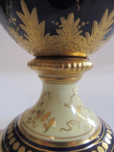 A PAIR OF COALPORT CHINA VASES AND COVERS of ovoid pedestal form Image