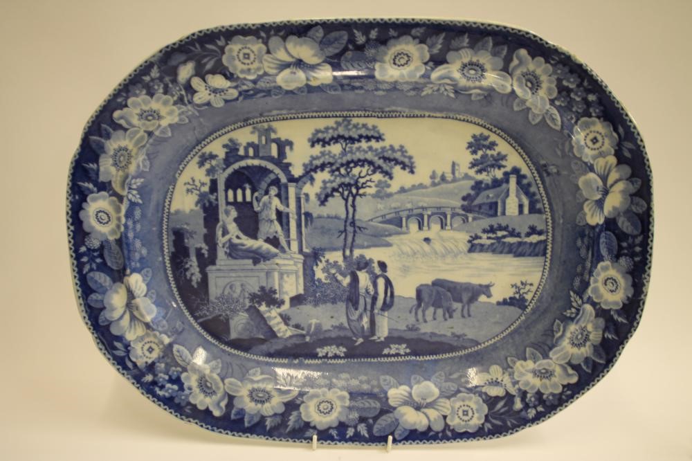A COLLECTION OF FOUR BLUE AND WHITE PRINTED EARTHENWARE MEAT PLATES comprising "The Philosopher" Image