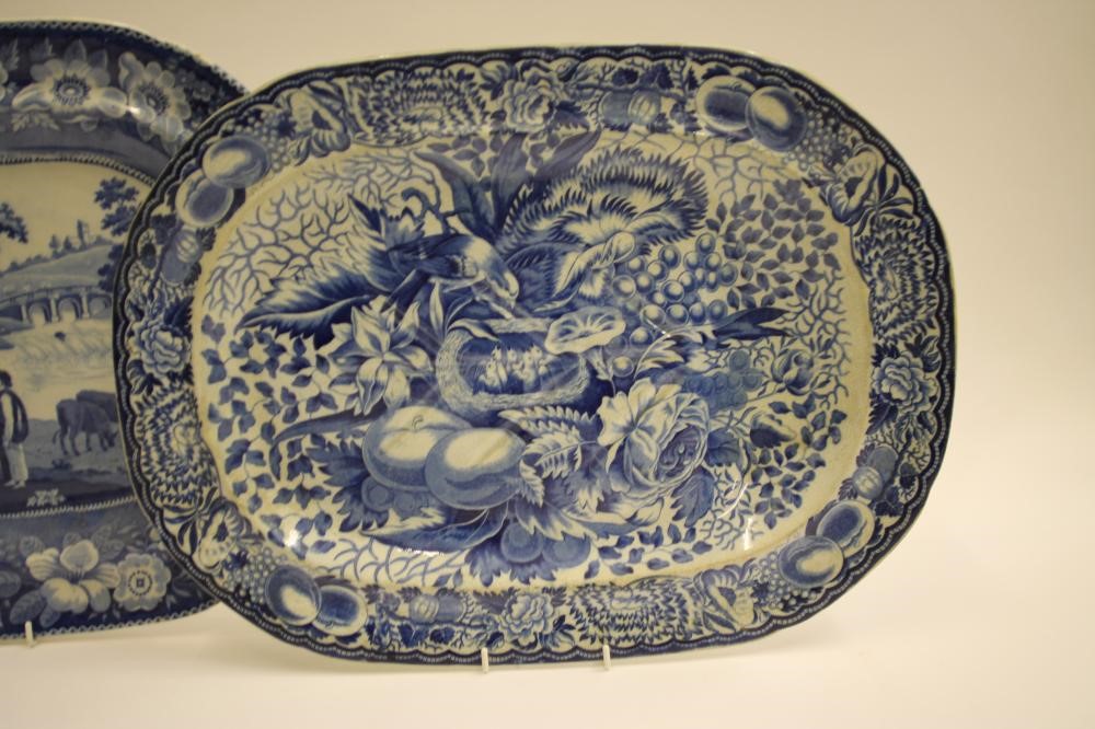 A COLLECTION OF FOUR BLUE AND WHITE PRINTED EARTHENWARE MEAT PLATES comprising "The Philosopher" Image