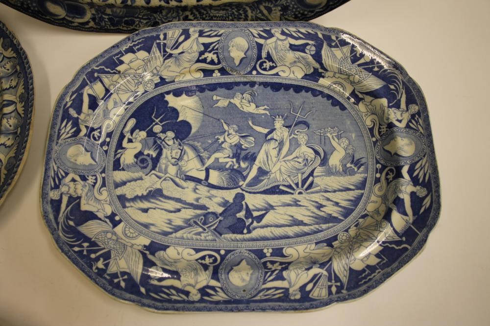 A COLLECTION OF FOUR BLUE AND WHITE PRINTED EARTHENWARE MEAT PLATES comprising "The Philosopher" Image