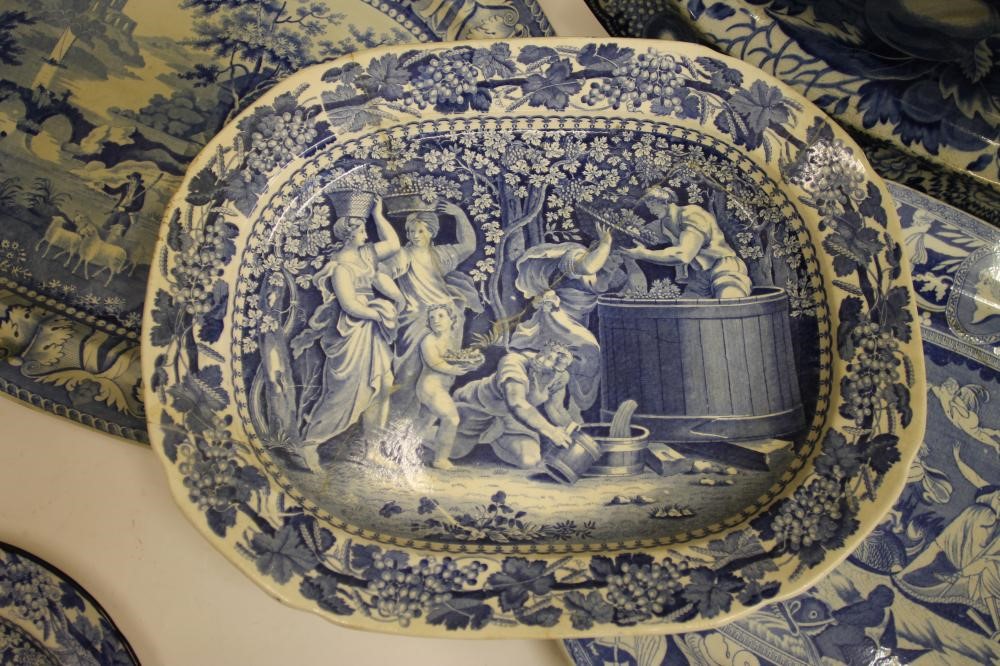 A COLLECTION OF FOUR BLUE AND WHITE PRINTED EARTHENWARE MEAT PLATES comprising "The Philosopher" Image
