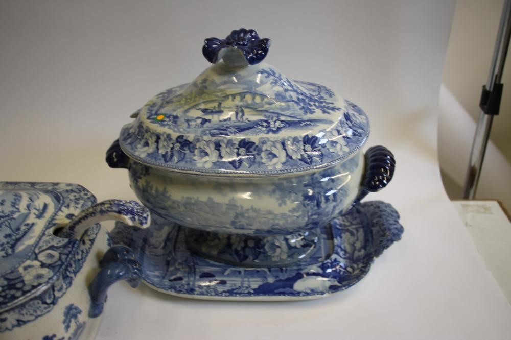 A QUANTITY OF BLUE AND WHITE PRINTED EARTHENWARE including a "Village Fisherman" tureen stand Image
