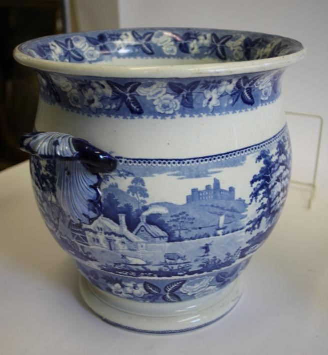 A LARGE BLUE AND WHITE PRINTED EARTHENWARE JUG of baluster form with scroll handle and lobed lug Image
