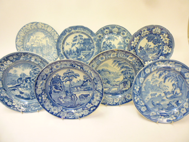 A COLLECTION OF EIGHT BLUE AND WHITE PRINTED EARTHENWARE PLATES comprising Riley's "Girl Musician" Image