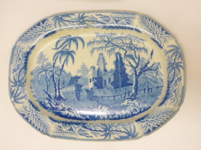 THREE BLUE AND WHITE PRINTED EARTHENWARE MEAT PLATES comprising a Davenport "Chinoiserie Ruins" Image