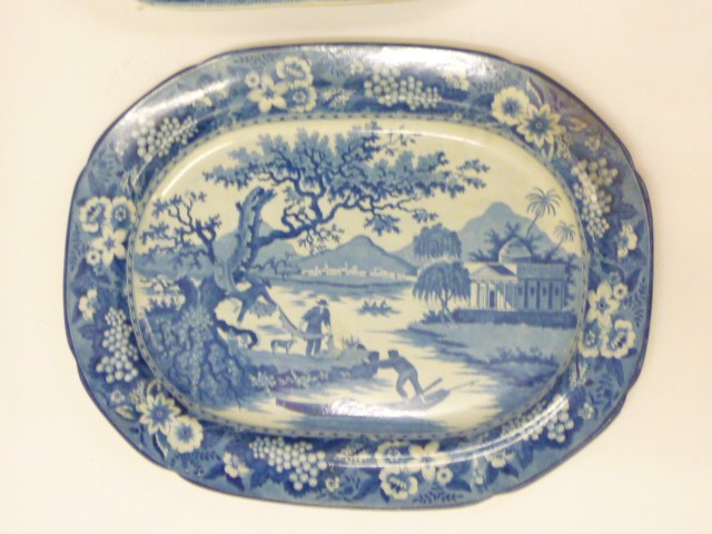 THREE BLUE AND WHITE PRINTED EARTHENWARE MEAT PLATES comprising a Davenport "Chinoiserie Ruins" Image