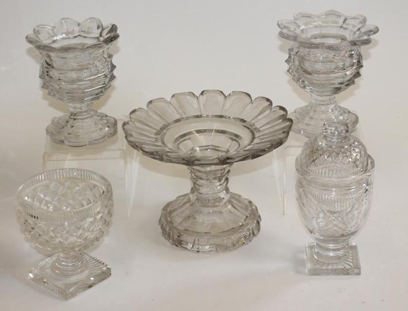 A GEORGIAN GLASS PINEAPPLE STAND with panel cut everted rim on octagonal hollow stem and swept foot Image