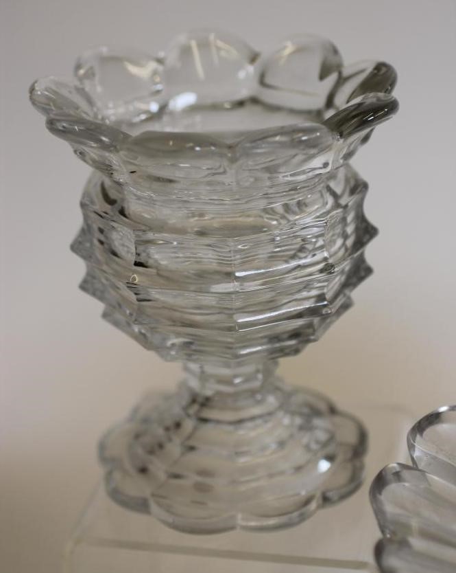 A GEORGIAN GLASS PINEAPPLE STAND with panel cut everted rim on octagonal hollow stem and swept foot Image
