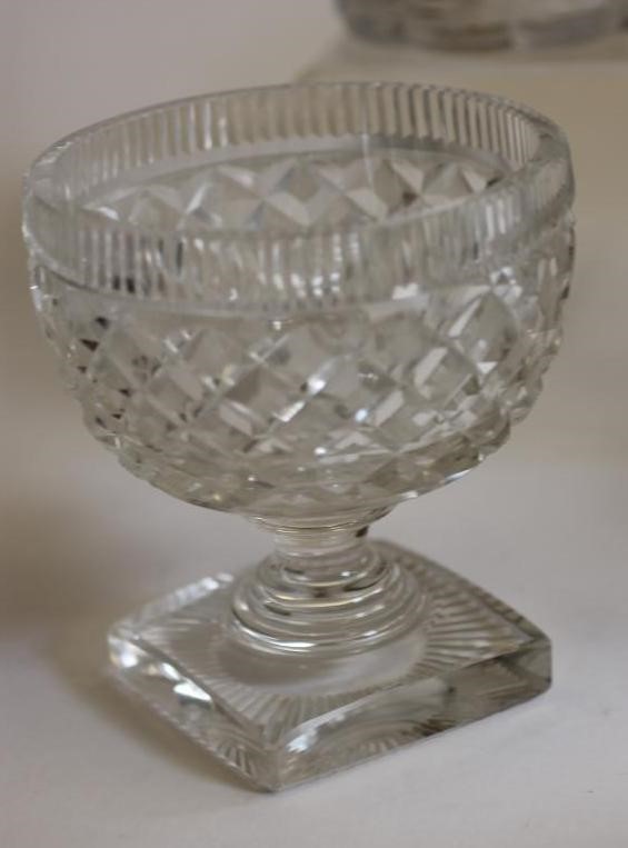A GEORGIAN GLASS PINEAPPLE STAND with panel cut everted rim on octagonal hollow stem and swept foot Image