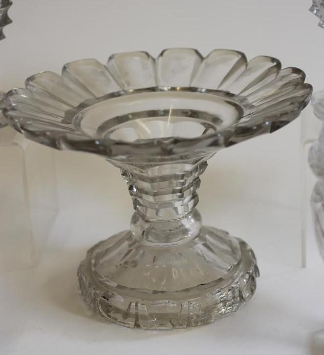 A GEORGIAN GLASS PINEAPPLE STAND with panel cut everted rim on octagonal hollow stem and swept foot Image