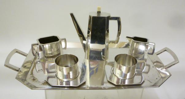 AN ART DECO SILVER PLATED PART TETE-A-TETE comprising a pair of cylindrical cups with canted square Image