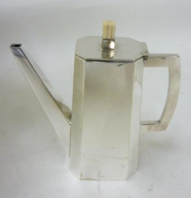 AN ART DECO SILVER PLATED PART TETE-A-TETE comprising a pair of cylindrical cups with canted square Image