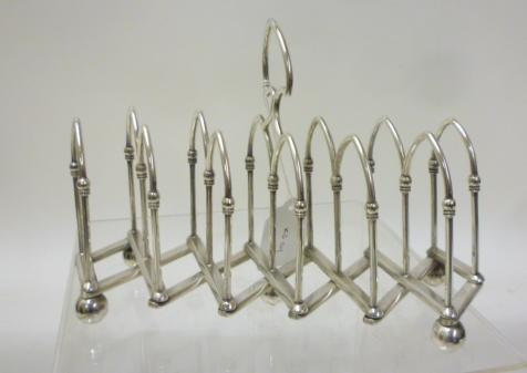 A LATE VICTORIAN SILVER PLATED CONCERTINA ACTION TOASTRACK Image