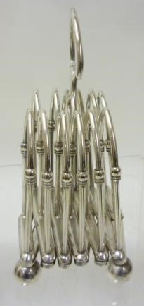 A LATE VICTORIAN SILVER PLATED CONCERTINA ACTION TOASTRACK Image