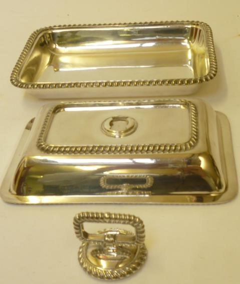 A SILVER PLATED ENTREE DISH AND COVER of rounded oblong form with gadrooned borders and detachable Image