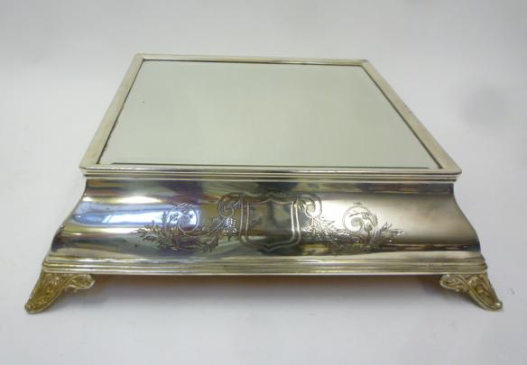 A SILVER PLATED MIRRORED CAKE PLATEAU Image