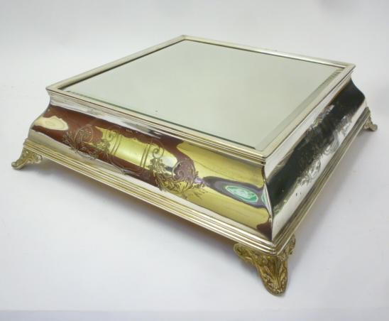 A SILVER PLATED MIRRORED CAKE PLATEAU Image