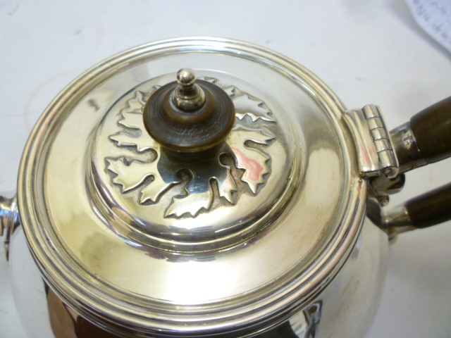 AN ARTS AND CRAFTS STYLE SILVER THREE PIECE TEA SERVICE Image