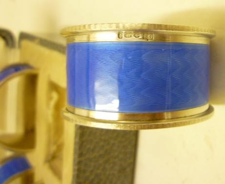 A SET OF FOUR ART DECO SILVER NAPKIN RINGS Image