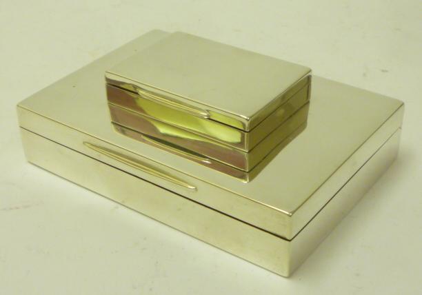 A SILVER CIGARETTE AND COMBINED MATCH BOX Image