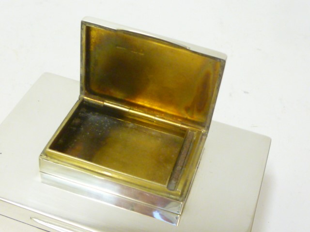 A SILVER CIGARETTE AND COMBINED MATCH BOX Image
