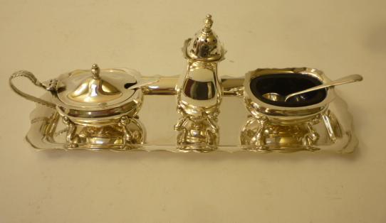 A SILVER THREE PIECE CRUET ON STAND Image