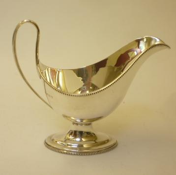 A SILVER PEDESTAL SAUCEBOAT Image