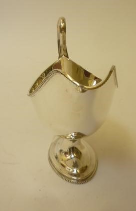 A SILVER PEDESTAL SAUCEBOAT Image
