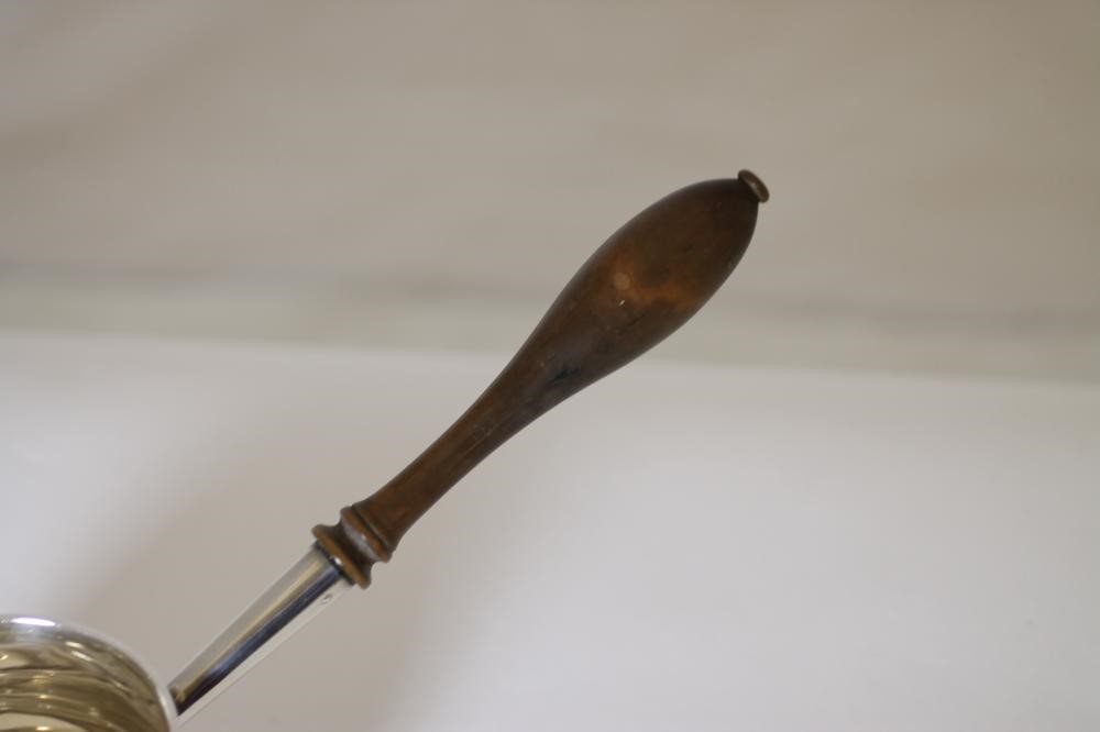 A LATE VICTORIAN SILVER BRANDY SAUCEPAN Image