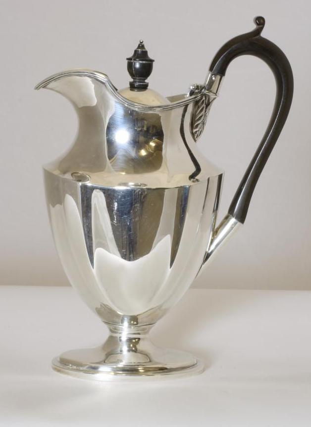 AN EDWARDIAN SILVER HOT WATER JUG Image