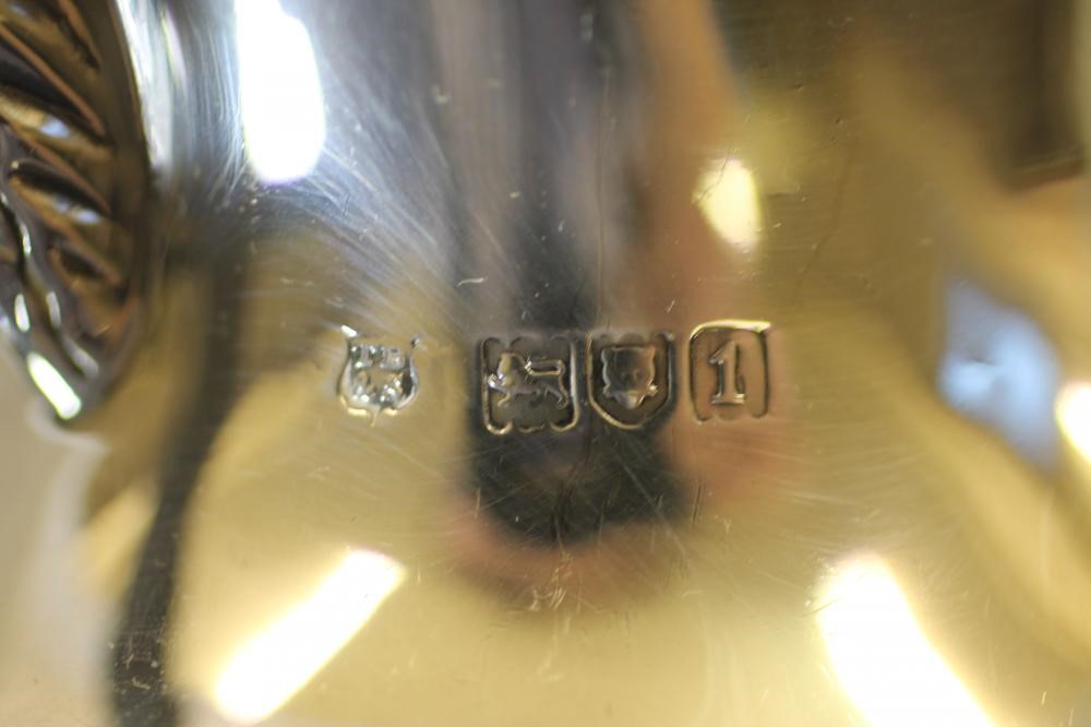 AN EDWARDIAN SILVER HOT WATER JUG Image