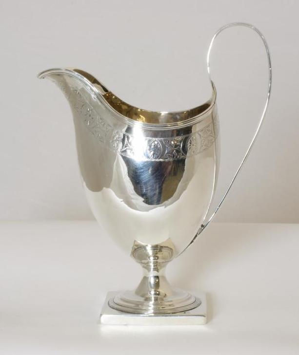 A GEORGE III SILVER PEDESTAL MILK JUG Image